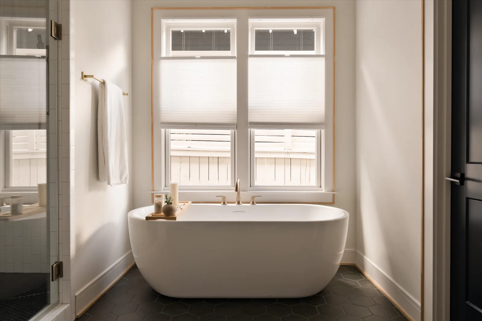 The freestanding tub under the windows