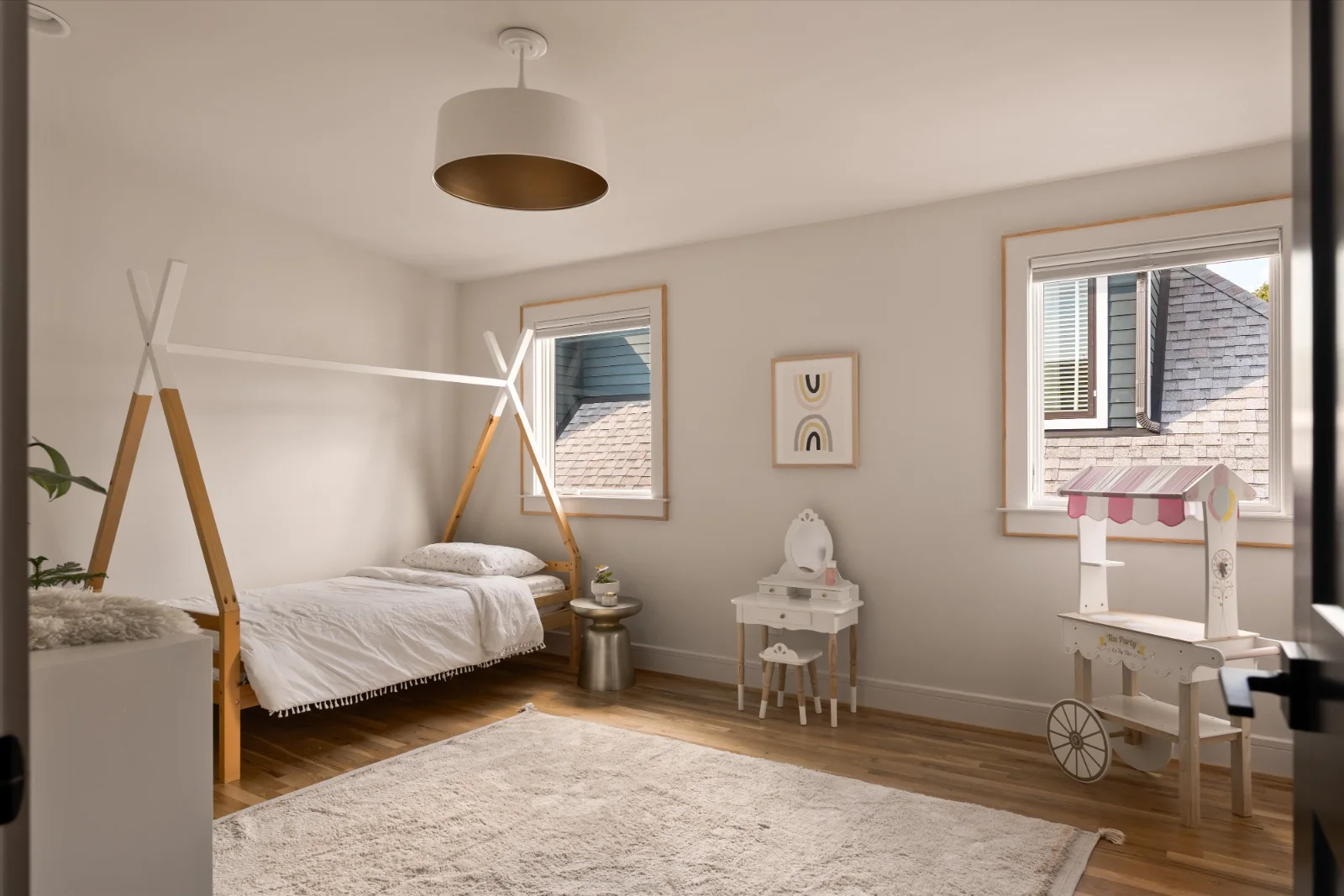 The second upstairs bedroom, corner windows on two walls