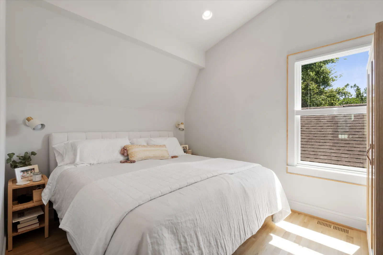 The guest suite bedroom under the slope of the roof