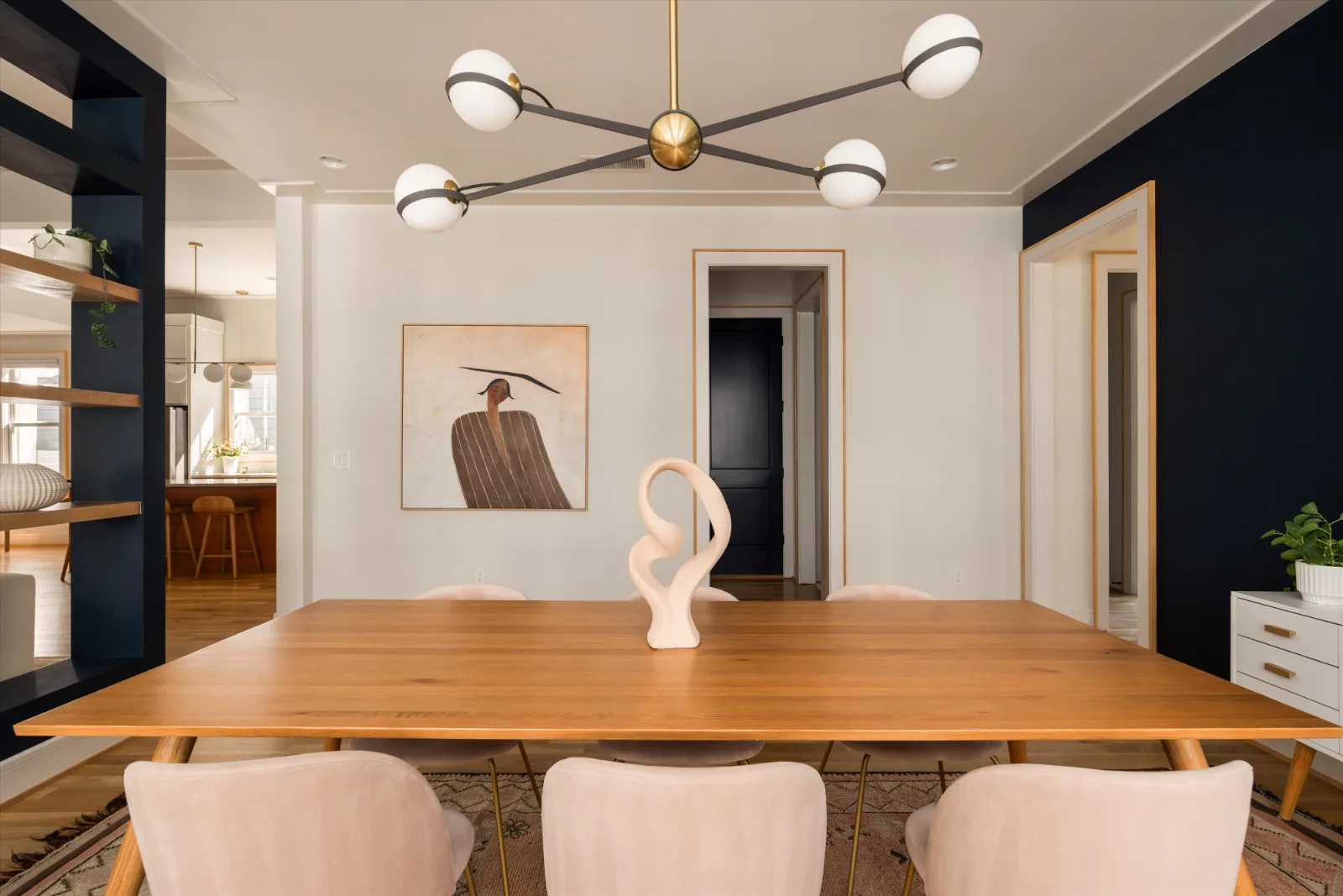 The dining room looking toward the kitchen, the partition shelving at left