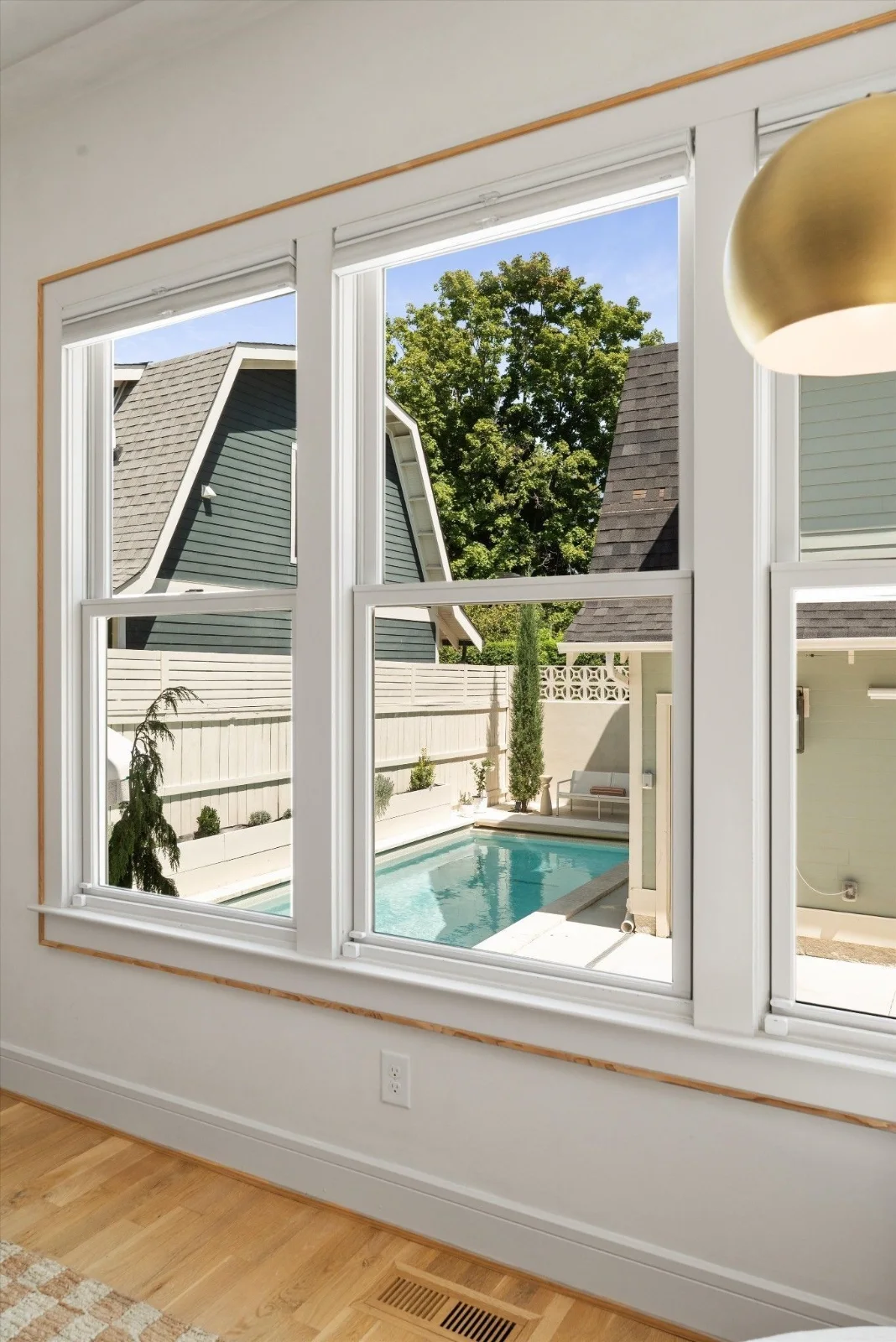 The saltwater pool and guest house seen from the primary bedroom windows